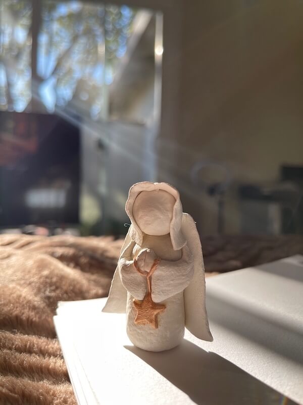 A small sculpture of an angel by Hang Luu.