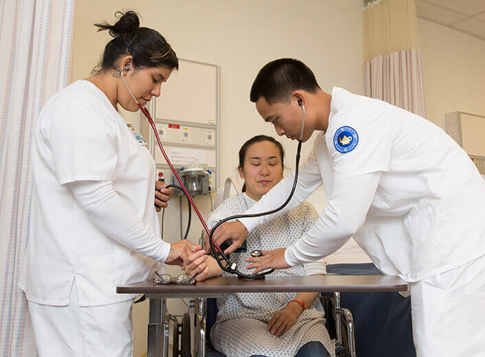 group of nurses checking pulse