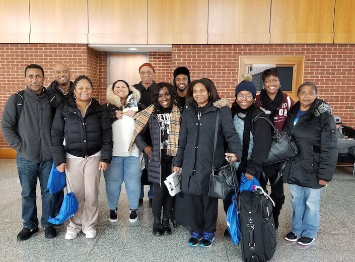 Group of Black students post together on an HBCU tour.